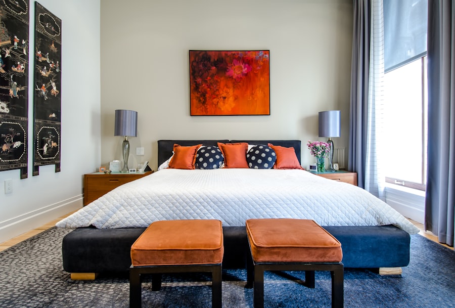 A made-up guest room with the bed turned down and the curtains open.